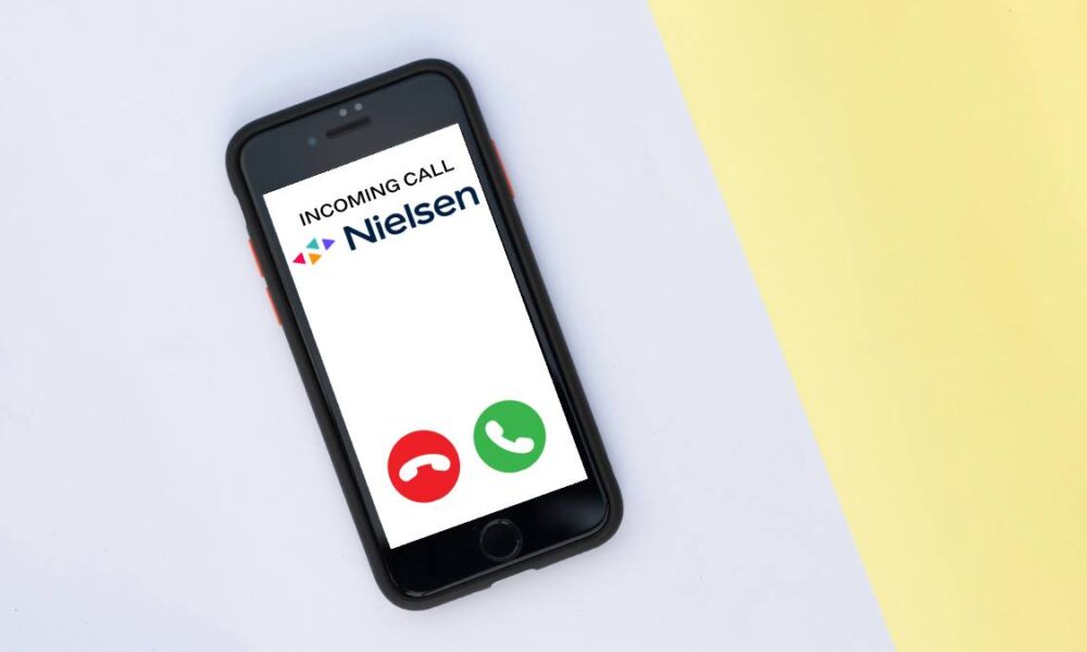 A photo of an iPhone receiving an incoming call from Nielsen